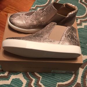 Rose gold snakeskin slip ons